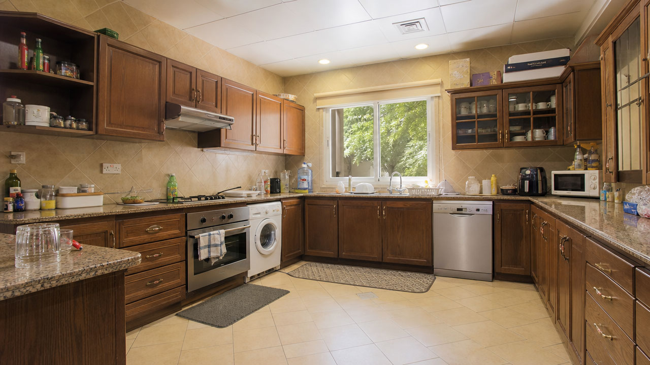 Dated dark-wood kitchen before PlanetDecore rebuild